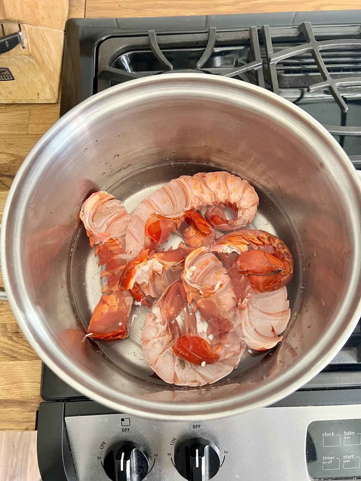 spiny lobster shells covered in water in a large pot