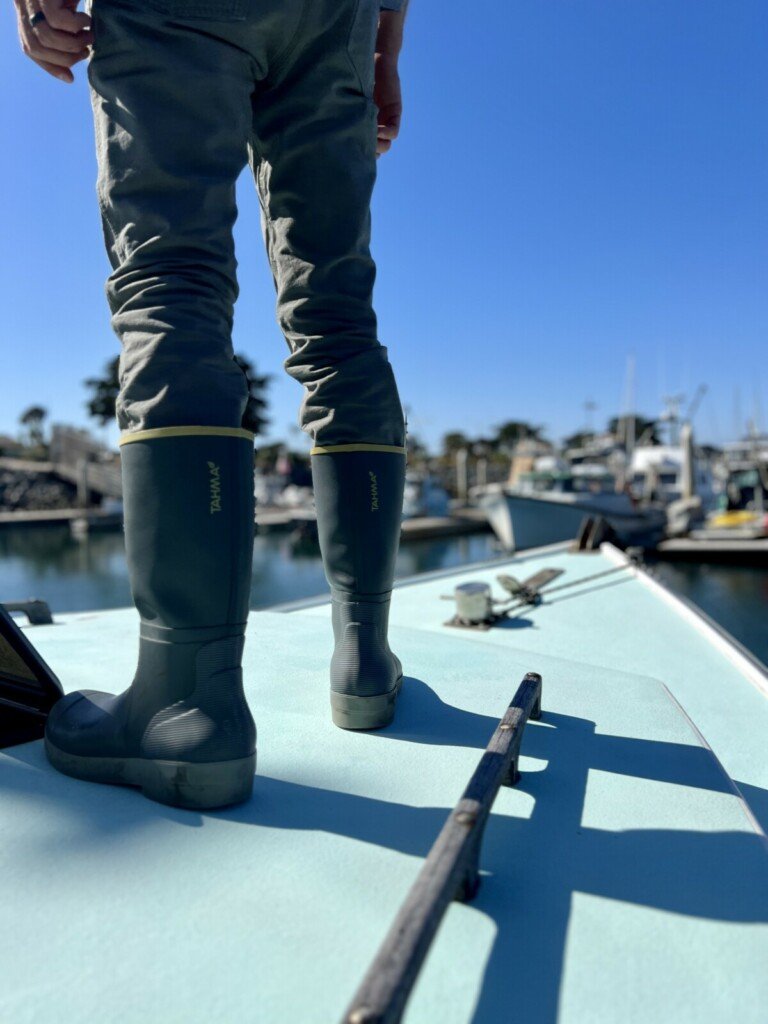 Commercial Spiny Lobster Fisherman wearing Tahma Grip Tech Boots on the bow of a boat in California 